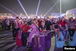 Migrant workers watch Qatar v Ecuador - Doha, Qatar on November 20, 2022. (REUTERS/Marko Djurica)