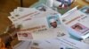 A polling station worker counts ballots during the second round of the presidential election at the polling station in Niamey, Niger, March 20, 2016.