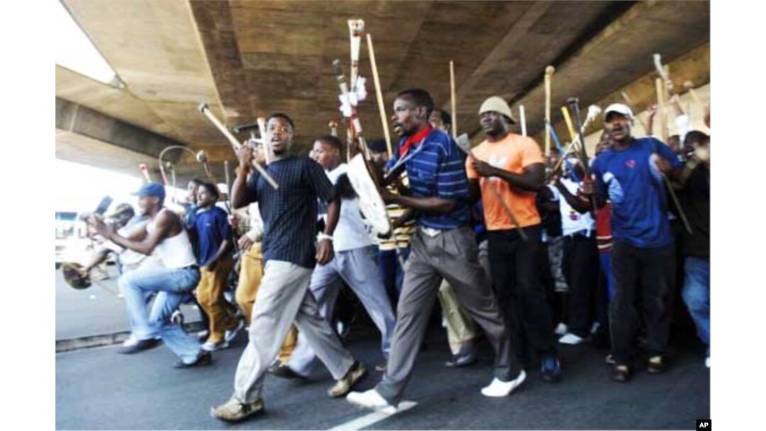 IFP supporters wielding traditional Zulu weapons march through Durban… The NFP accuses the IFP of intimidation ahead of South Africa’s municipal polls on May 18