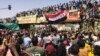 Protesters rally at a demonstration near the military headquarters in the capital Khartoum, Sudan, April 9, 2019.