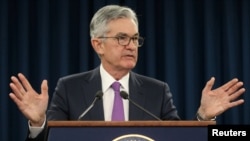 FILE - Federal Reserve Chairman Jerome Powell holds a press conference in Washington, U.S., Jan. 30, 2019. 