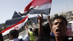 Egyptians shout anti-Mubarak slogans as they demonstrate in front of the hospital where former Egyptian President Hosni Mubarak, 82, is being treated in the Red Sea resort of Sharm el-Sheikh, Egypt, Wednesday, April 13, 2011.