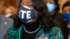 Rep. Terri Sewell, D-Ala., wears a pin honoring John Lewis while standing alongside other members of the Congressional Black Caucus speaking in front of the Senate chambers about voting rights legislation at the Capitol in Washington, Jan. 19, 2022.