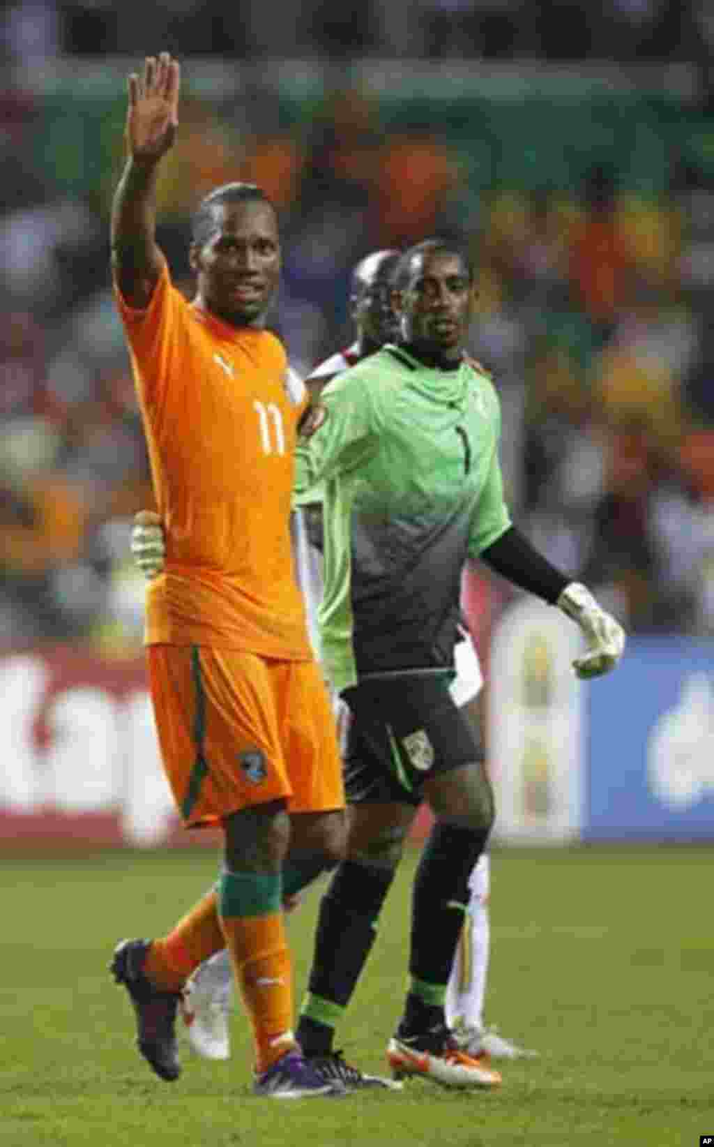 Ivory Coast's Didier Drogba celebrates with goalkeeper Boubacar Barry after they won their African Nations Cup semi-final soccer match against Mali at the Stade De L'Amitie Stadium in Gabon's capital Libreville February 8, 2012.