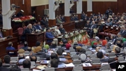 Afghan President Ashraf Ghani, center left, makes an address as he inaugurates a new session of parliament at the parliament house in Kabul, Afghanistan, March 7, 2015.