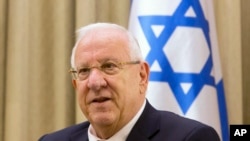 FILE - Israel President Reuven Rivlin attends a meeting at the President's residence in Jerusalem, Nov. 3, 2014.