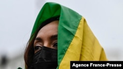 An activist listens to speakers supporting the Ethiopian government during a protest in Washington on Nov. 21, 2021.