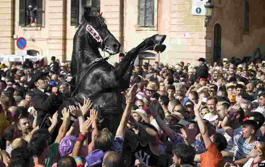 A horse rears in the crowd during the traditional Sant Joan (Saint John) festival in the town of Ciutadella, on the Balearic Island of Minorca, Spain, June 23, 2019.