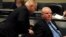 Toronto Councilor Doug Ford, left, speaks to brother, Mayor Rob Ford, during city council meeting, Nov, 15, 2013.