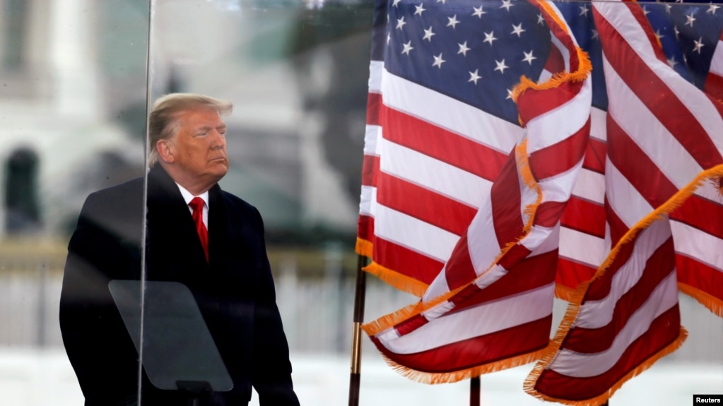 FILE - U.S. President Donald Trump looks on at the end of his speech during a rally to contest the certification of the 2020 U.S. presidential election results by the U.S. Congress, in Washington, Jan. 6, 2021.
