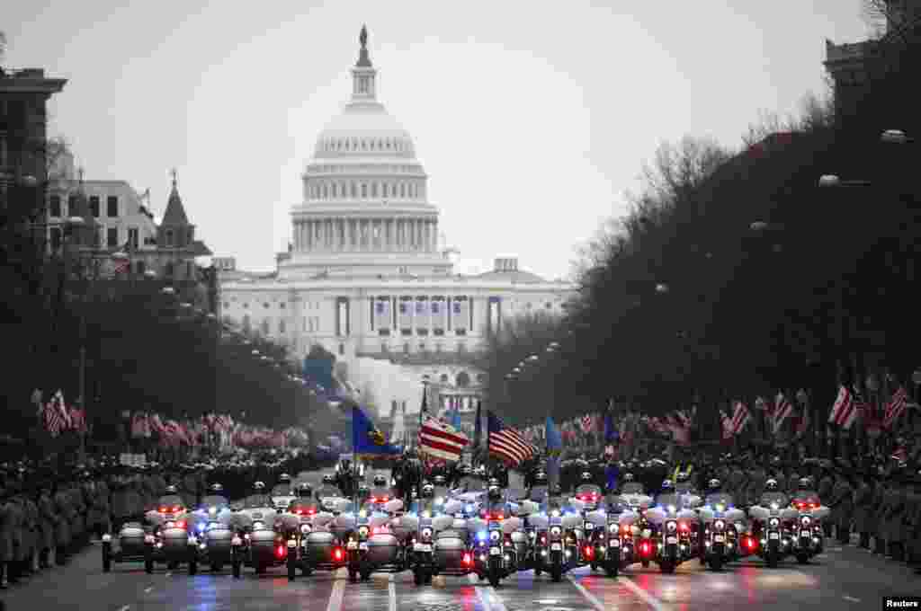 Washington, D.C., motorcycle police lead the inaugural parade for U.S. President Donald Trump after he was sworn in at the Capitol (background) in Washington, D.C., Jan. 20, 2017. 