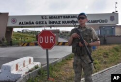FILE - A Turkish soldier guards the entrance to the prison complex in Aliaga, Izmir province, western Turkey, where jailed U.S. pastor Andrew Craig Brunson is appearing on his trial at a court inside the complex, May 7, 2018.