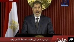 ປະທາ​ນາ​ທິບໍດີ Mohamed Morsi ​ໄດ້​ປະຕິ​ເສດ​ທີ່​ຈະ​ຍົກ​ເລີກ ​ການ​ລົງປະຊາ​ມະຕິ​ເພື່ອ​ຮັບຮອງ​ເອົາ​ຮ່າງ​ລັດຖະທຳ​ມະນູນ​