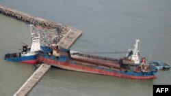 An aerial view from a Jiji Press helicopter shows a ship that collided with a breakwater due to strong winds caused by typhoon Jebi in Nishinomiya city, Hyogo prefecture on September 5, 2018.