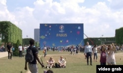 General view of the soccer fan zone on the Champ de Mars near the Eiffel Tower in Paris.