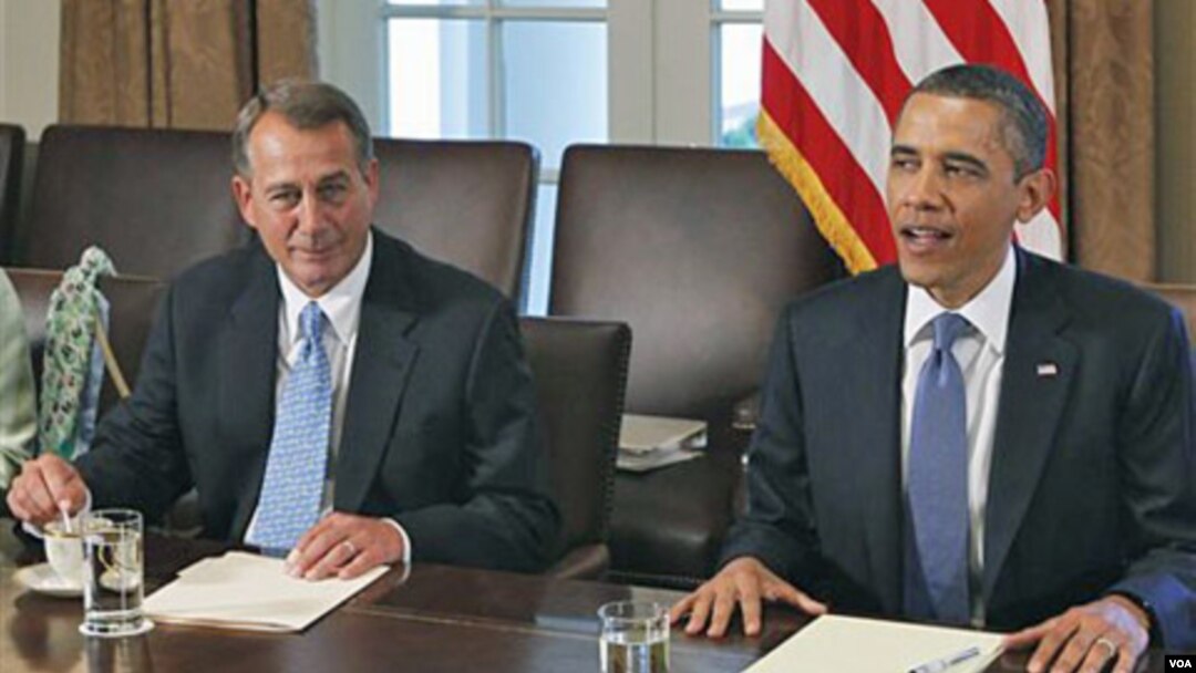 Presiden Barack Obama dan Ketua DPR AS dari partai Republik, John Boehner (kiri) dalam pertemuan di Gedung Putih (11/7).