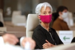 FILE - European Central Bank President Christine Lagarde, wearing a face mask, attends the 16th Congress of Regions (Congres des Regions) in Saint-Ouen, north of Paris, Oct. 19, 2020.