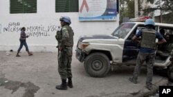 A police station is burning in Mariupol, eastern Ukraine. Fighting between government forces and rebels in the city left several people dead on Friday.