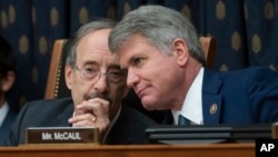 House Foreign Affairs Committee Chairman Eliot Engel, D-N.Y., left, and Rep. Michael McCaul, R-Texas, the ranking member, confer as the panel holds a hearing titled, "The Betrayal of our Syrian Kurdish Partners," Oct. 23, 2019. 