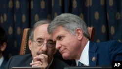 House Foreign Affairs Committee Chairman Eliot Engel, D-N.Y., left, and Rep. Michael McCaul, R-Texas, the ranking member, confer as the panel holds a hearing titled, "The Betrayal of our Syrian Kurdish Partners," Oct. 23, 2019. 