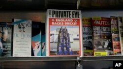 A copy of the satirical Private Eye magazine is displayed for sale with a Brexit themed cover in a store in London, Wednesday, June 8.