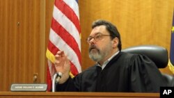 Alaska Superior Court Judge William Morse gestures while questioning Sen. Bill Wielechowski, D-Anchorage, during a hearing Nov. 17, 2016, in Anchorage, Alaska. Morse ruled against Wielechowski, who sued the state along with two former lawmakers, contending Gov. Bill Walker didn’t have the authority to reduce this year’s Alaska Permanent Fund dividend payout.
