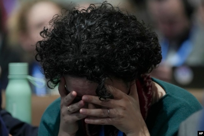 An attendee reacts during the closing plenary session at the COP29 U.N. Climate Summit in Baku, Azerbaijan, Nov. 24, 2024.