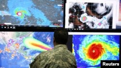A member of the Emergency Operations Committee (COE) monitors the trajectory of Hurricane Irma in Santo Domingo, Dominican Republic, Sept. 5, 2017. 
