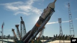 The Soyuz rocket is raised into a vertical position on the launch pad, Oct. 9, 2018 at the Baikonur Cosmodrome in Kazakhstan. 