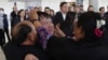 Thai hostage who were freed from Hamas, Bannawat Saethao, second from left, hugs his relatives of upon his arrival at Suvarnabhumi International Airport, in Samut Prakarn Province, Thailand, Feb. 9, 2025.