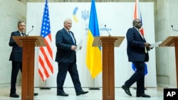 U.S. Secretary of State Antony Blinken, left, Britain's Foreign Secretary David Lammy, right, and Ukraine's new Foreign Minister Andrii Sybiha arrive for a joint news conference at the Ministry of Foreign Affairs in Kyiv, Ukraine, Sept. 11, 2024.