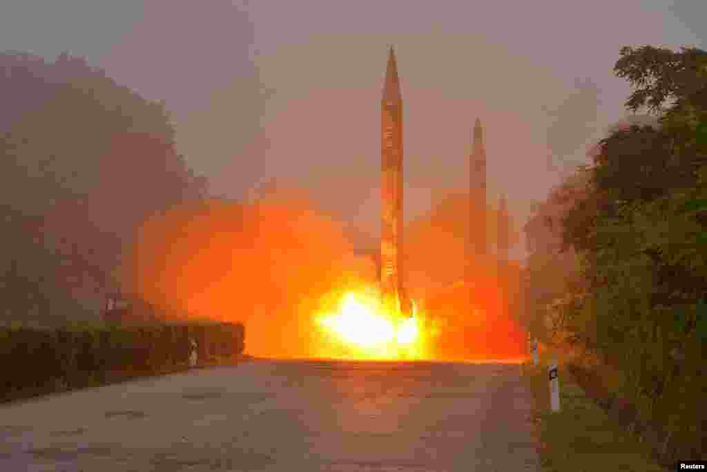 Ballistic rocket is seen launching during a drill by the Hwasong artillery units of the KPA Strategic Force in this undated picture provided by KCNA in Pyongyang, North Korea.