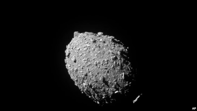 This image provided by NASA shows the asteroid Dimorphos, captured by NASA’s DART mission just two seconds before the spacecraft struck its surface, on Sept. 26, 2022. (NASA/Johns Hopkins APL via AP)