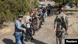 Armenian military volunteers undergo combat training at a camp in Yerevan, Armenia Oct. 27, 2020. 