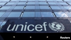 FILE - The UNICEF logo is pictured on a building in Geneva.