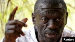 FILE - Opposition leader Kizza Besigye speaks during a news conference at his home at the outskirts of Kampala, Uganda, Feb. 21, 2016. His lawyer says the latest charges against his client are "just harassment."