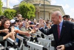 FILE - Turkey's President Recep Tayyip Erdogan speaks to supporters in Ankara, Aug. 23, 2019.