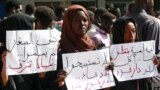 People demonstrate against the way police handled a student protest over a shortage of bread in Darfur's state capital Nyala the previous day, in Khartoum, Sept. 23, 2019.