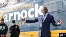 Georgia Senatorial candidate Reverend Raphael Warnock speaks to supporters at a canvassing event on January 5, 2021 in Marietta, Georgia.