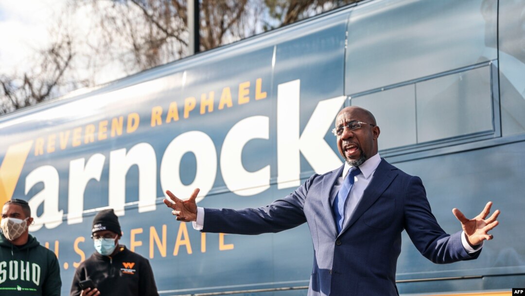 Georgia Senatorial candidate Reverend Raphael Warnock speaks to supporters at a canvassing event on January 5, 2021 in Marietta, Georgia.
