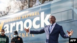 Georgia Senatorial candidate Reverend Raphael Warnock speaks to supporters at a canvassing event on January 5, 2021 in Marietta, Georgia.