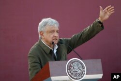 FILE - Mexican President Andres Manuel Lopez Obrador speaks during a rally in Tijuana, Mexico, June 8, 2019.