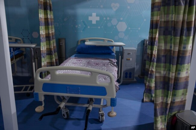 In this June 17, 2020 file photo, hospital beds are prepared to receive COVID-19 patients at Ain Shams University Field Hospital in the Egyptian capital, Cairo. (AP Photo/Nariman El-Mofty, File)