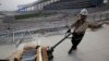 A laborer works at the Incheon Asiad Main Stadium that is being built for the 17th Asian Games in Incheon April 10, 2014. Vietnam has decided not to host the 2019 Asian Games.