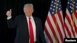 U.S. Republican presidential candidate Donald Trump takes the stage at a campaign rally in Warwick, Rhode Island, April 25, 2016. 