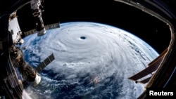 Super Typhoon Trami is seen from the International Space Station as it moves in the direction of Japan, Sept. 25, 2018, in this image obtained from social media on Sept. 26, 2018. (ESA/NASA-A.Gerst/via Reuters)