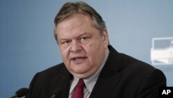 Greece's Socialist leader Evangelos Venizelos talks to the media after his meeting with Democratic Left leader Fotis Kouvelis at the Greek Parliament in Athens, May 10, 2012.