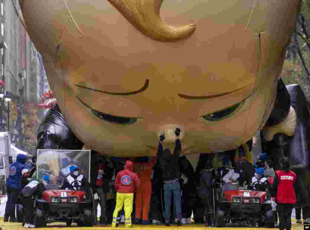 The Boss Baby balloon is deflated as it ends its appearance during the modified Macy&#39;s Thanksgiving Day Parade in New York.