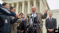 Michael Carvin, center, lead attorney for the petitioners, speaks to reporters outside the Supreme Court in Washington, March 4, 2015.