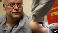 Steve Sierzega receives a measles, mumps and rubella vaccine at the Rockland County Health Department in Pomona, New York, March 27, 2019. 